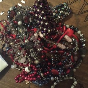 Bag of homemade beaded jewelry.